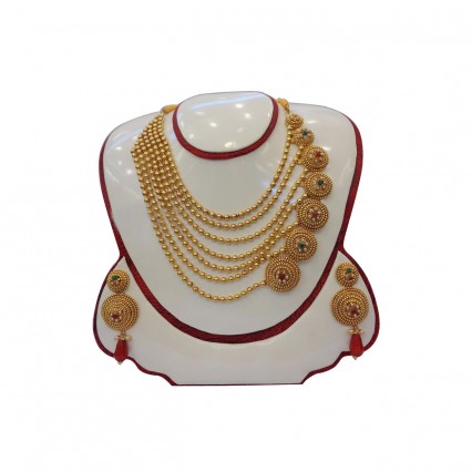 Beautiful work in artificial red, green stone and pearl  with ethnic and modern design combination golden work, this is a really warm and glowing necklace set. It’s very ethnic earring adds to the festive appearance as it truly dazzles
